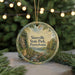 A round ornament with a scenic landscape of Sizersville State Park, Pennsylvania, featuring a river, trees, and mountains.