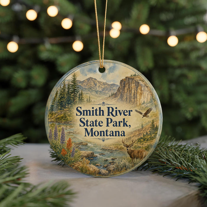A round ornament with a scenic landscape of Smith River State Park, Montana, featuring a mountain, river, and wildlife.