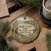 A decorative ornament featuring a scenic landscape of Snake Creek State Recreation Area in South Dakota, with pine trees and a body of water in the background.