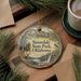 A decorative ornament with a scenic landscape of Snowdale State Park, Oklahoma, featuring a deer, pine trees, and a waterfall.