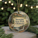 A circular ornament with a scenic landscape of Snowdale State Park, Oklahoma, featuring a bird, a deer, and a waterfall.