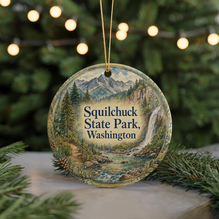 A circular ornament with a scenic mountain landscape and waterfall, featuring the text "Squilchuck State Park, Washington".