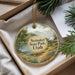 A round ornament with a scenic landscape of Steiner State Park, Utah, featuring mountains, a lake, and a cabin.