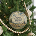 A round ornament hanging on a Christmas tree, featuring a scenic image of Steptoe Battlefield State Park in Washington.