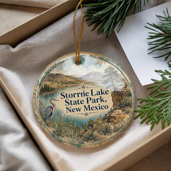 A decorative ornament with a scenic landscape of Storrie Lake, Storrie State Park, New Mexico, featuring a heron and other natural elements.
