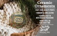 Ceramic ornaments, specifically those featuring Talimana State Park, Oklahoma, are displayed in a basket. The text highlights the ornaments as "cozy, high-quality prints" and "vibrant and long lasting", with a description of their shipping speed and packaging. The image also includes a logo for "Flying Pig - SIGN COMPANY".