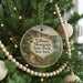 A round ornament on a Christmas tree, featuring a scenic image of Tallman Mountain State Park in New York.