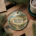 A decorative ornament with a scenic landscape of Terry and Rae State Park, Wisconsin, featuring a bird and pine trees.