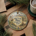 A decorative ornament with a scenic illustration of a park, mountains, and buildings, along with the text "This is the Place Heritage Park, Utah".