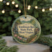 A round ornament with a scenic image of Tomlinson Run State Park, West Virginia, hanging from a string.