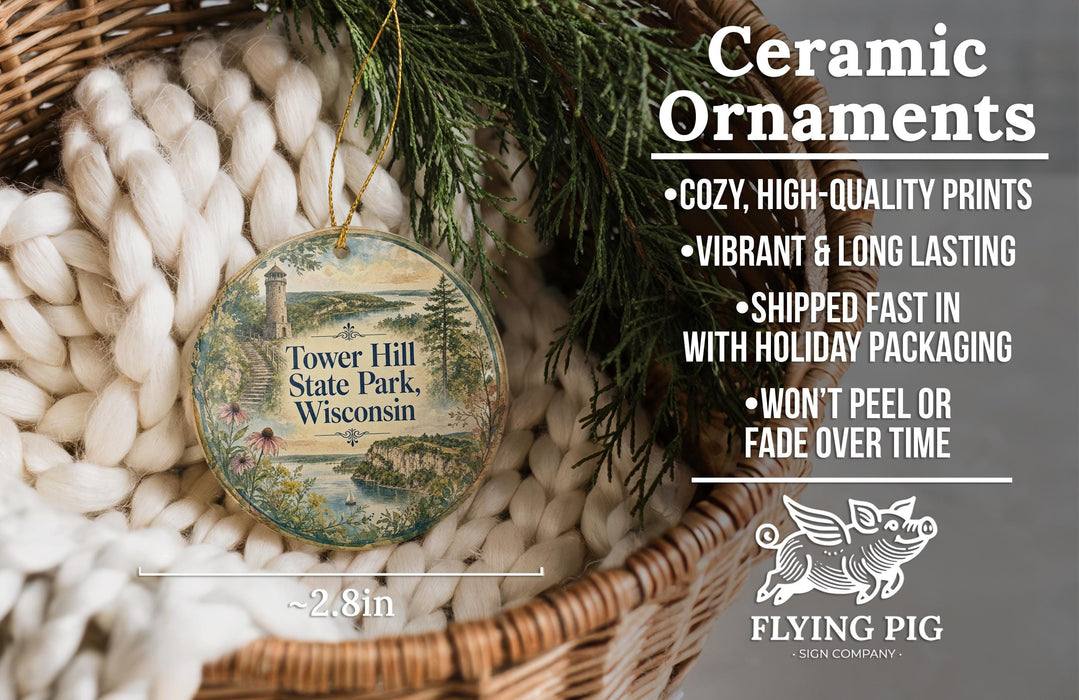 Ceramic ornaments, featuring a detailed illustration of Tower Hill State Park, Wisconsin, are displayed in a wicker basket. The text highlights the ornaments as "Cozy, High-quality prints" and "Vibrant & long lasting", with a description of their shipping speed and packaging. The image also includes a logo for "Flying Pig - SIGN COMPANY" and a scale indicating the size of the ornaments is "-2.8in".
