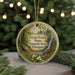 A circular ornament with a scenic forest landscape and a waterfall, featuring text that reads "Tryon Creek State Natural Area Oregon".