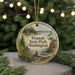 A round ornament with a scenic landscape of Twanoh State Park, Washington, featuring a mountain, pine trees, and a cabin.