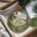 A decorative ornament with a scenic image of Twin Falls Resort State Park, West Virginia, hanging from a string.