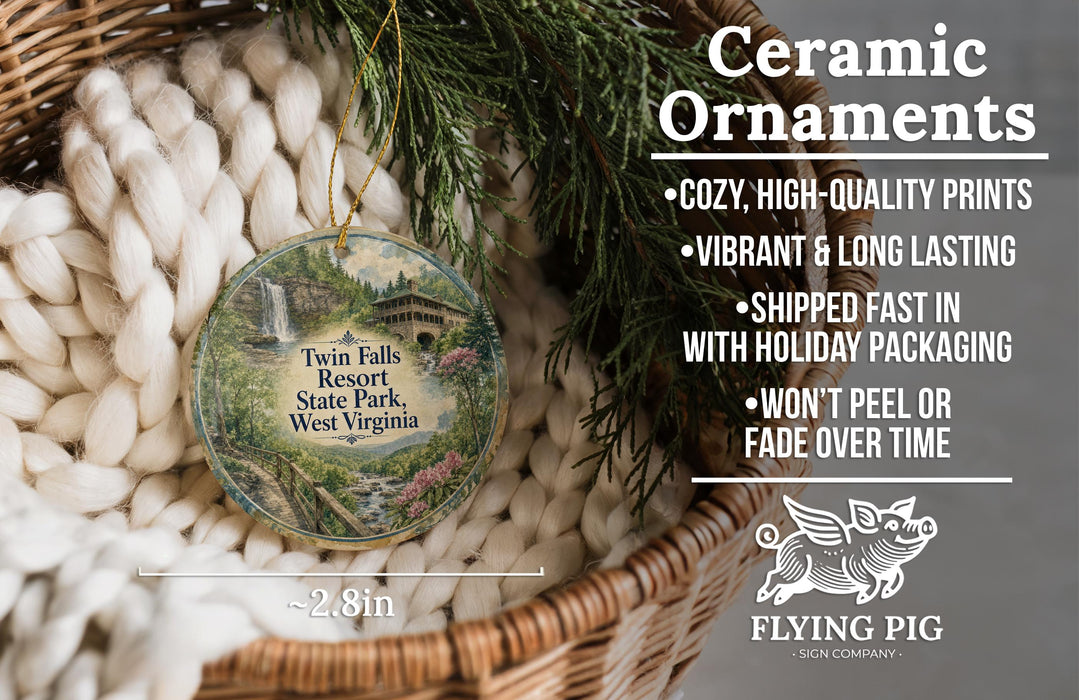 Ceramic ornaments, featuring a round ornament with a scenic image of Twin Falls Resort State Park, West Virginia, hanging from a wicker basket.