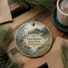 A decorative ornament featuring a scenic image of Twin Harbors State Park in Washington, with pine trees and a lighthouse in the background.