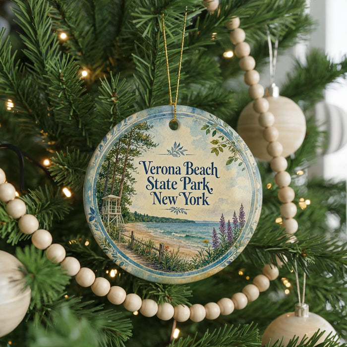 A round ornament hanging on a Christmas tree, featuring a scenic image of Verona Beach State Park, New York.