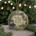 A circular ornament with a painting of a boat on a river, surrounded by trees and buildings, with the text "Washington Crossing State Park, New Jersey" displayed on it.