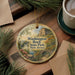 A decorative ornament featuring a scenic landscape of Washington Rock State Park, New Jersey, with a bridge and pine trees in the background.