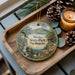 A wooden tray with a decorative ornament featuring a scenic landscape of Weeks State Park, New Hampshire, and pine cones.