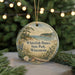 A round ornament with a scenic landscape of Whitefish Dunes State Park, Wisconsin, featuring a pine tree, a lake, and a bird in flight.