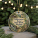 A round ornament with a scenic illustration of Wilderness Road State Park, Virginia, featuring a cabin, a path, and a waterfall.