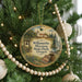 A Christmas tree ornament featuring a scenic image of Willamette Mission State Park, Oregon, with a bell and a basket of blankets.