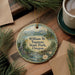 A round ornament with a scenic landscape of William M. Tugman State Park, Oregon, featuring a river, mountains, and pine trees.