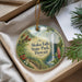 A decorative ornament with a scenic image of Akaka Falls State Park, Hawaii, hanging from a string.