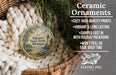 Ceramic ornaments, featuring a lighthouse and Michigan landscape, are displayed in a basket with a woven blanket.