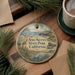 A decorative ornament with a scenic landscape of Ano Nuevo State Park, California, featuring a bird, a bear, and a body of water.