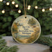 A round ornament with a scenic landscape of Bay City, Michigan, featuring a lighthouse, trees, and a body of water.