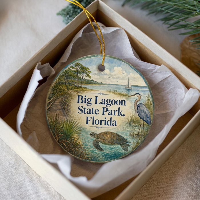 A circular ornament with a beach scene and a bird, featuring the text "Big Lagoon State Park, Florida" on it.