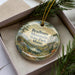 A decorative ornament with a scenic mountain landscape, featuring the words "Bradbury Mountain State Park, Maine" prominently displayed.