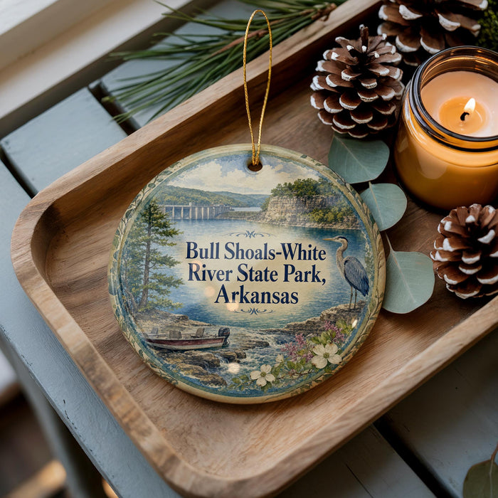 A decorative ornament featuring a scenic image of the Bull Shoals-White River State Park in Arkansas, with a candle and pine cones on a wooden tray.
