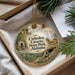 A decorative ornament with a scenic image of the Cathedral Caves in Alabama, displayed in a box with pine branches.