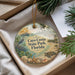 A decorative ornament with a beach scene and various sea creatures, including a bird, a boat, and a turtle, is displayed in a box.