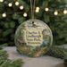 A circular ornament featuring a cabin and a landscape scene, with the text "Charles A. Lindbergh State Park, Minnesota" displayed prominently.