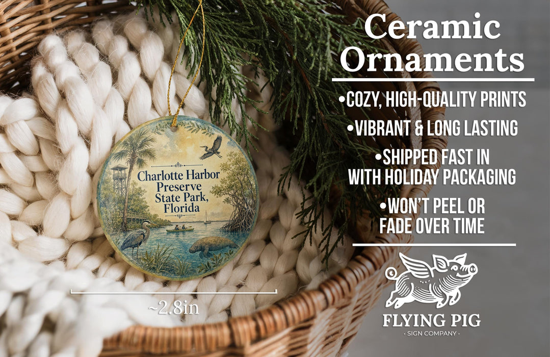 Ceramic ornaments, featuring a detailed illustration of a tropical scene with palm trees and a bird, are displayed in a woven basket.