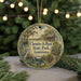A circular ornament with a painting of a pond and a bird, surrounded by greenery, with the text "Chemin-A-Haut State Park, Louisiana" displayed on it.