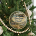 A round ornament hanging on a Christmas tree, featuring a scenic image of China Camp State Park, California.