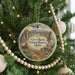 A round ornament hanging on a Christmas tree, featuring a scenic illustration of the City of Rocks National Reserve in Idaho.