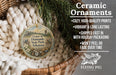 Ceramic ornaments, specifically a Crater of Diamonds State Park, Arkansas ornament, are displayed in a basket with pine branches. The ornament is described as having a cozy, high-quality print, vibrant and long-lasting, and being shipped fast in holiday packaging. It is also noted that it won't peel or fade over time.