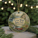 A decorative ornament featuring a scenic landscape of Crow Wing State Park in Minnesota, with a canoe and other wildlife elements.
