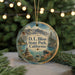 A round ornament with a scenic mountain landscape and water, featuring the text "D.L. Bliss State Park, California".