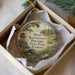 A round ornament in a box, featuring a painting of a historic state park and a house, with the text "Dade Battlefield Historic State Park, Florida" printed on it.