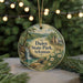 A decorative ornament featuring a scenic landscape with a waterfall, surrounded by pine trees and flowers, with the text "Daisy State Park, Arkansas" prominently displayed.