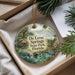 A decorative ornament with a scenic image of De Leon Springs State Park, Florida, featuring a manatee, a bird, and a wooden cabin.