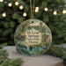 A round ornament with a scenic image of De Leon Springs State Park, Florida, featuring a manatee, a bird, and a house.