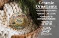 Ceramic ornaments, featuring a Dead Horse Ranch State Park, Arizona ornament, are displayed in a basket with pine branches.